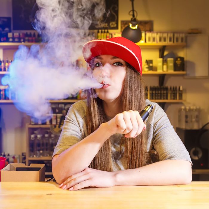 woman vaping in shop