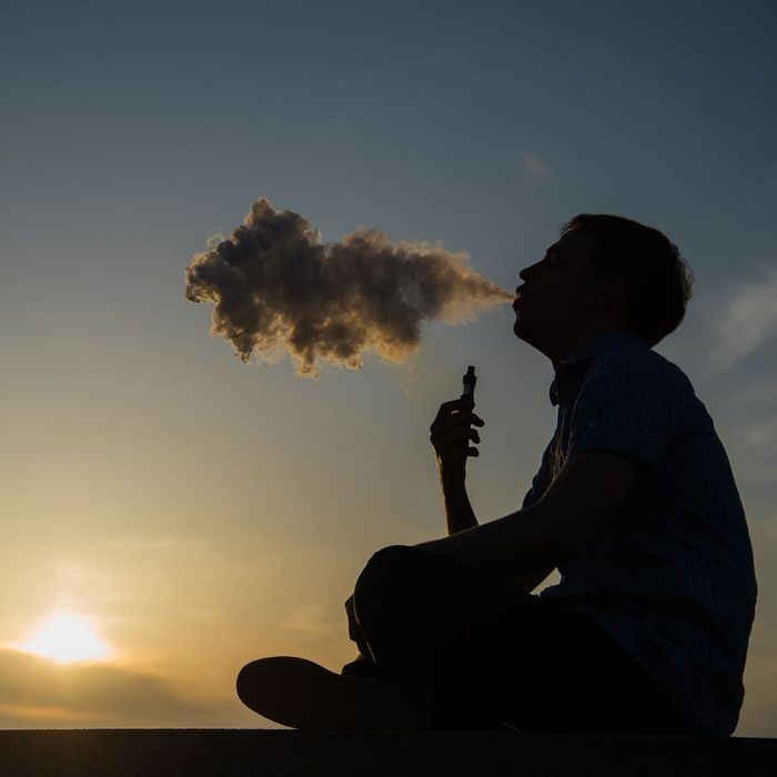 silhouette of man vaping