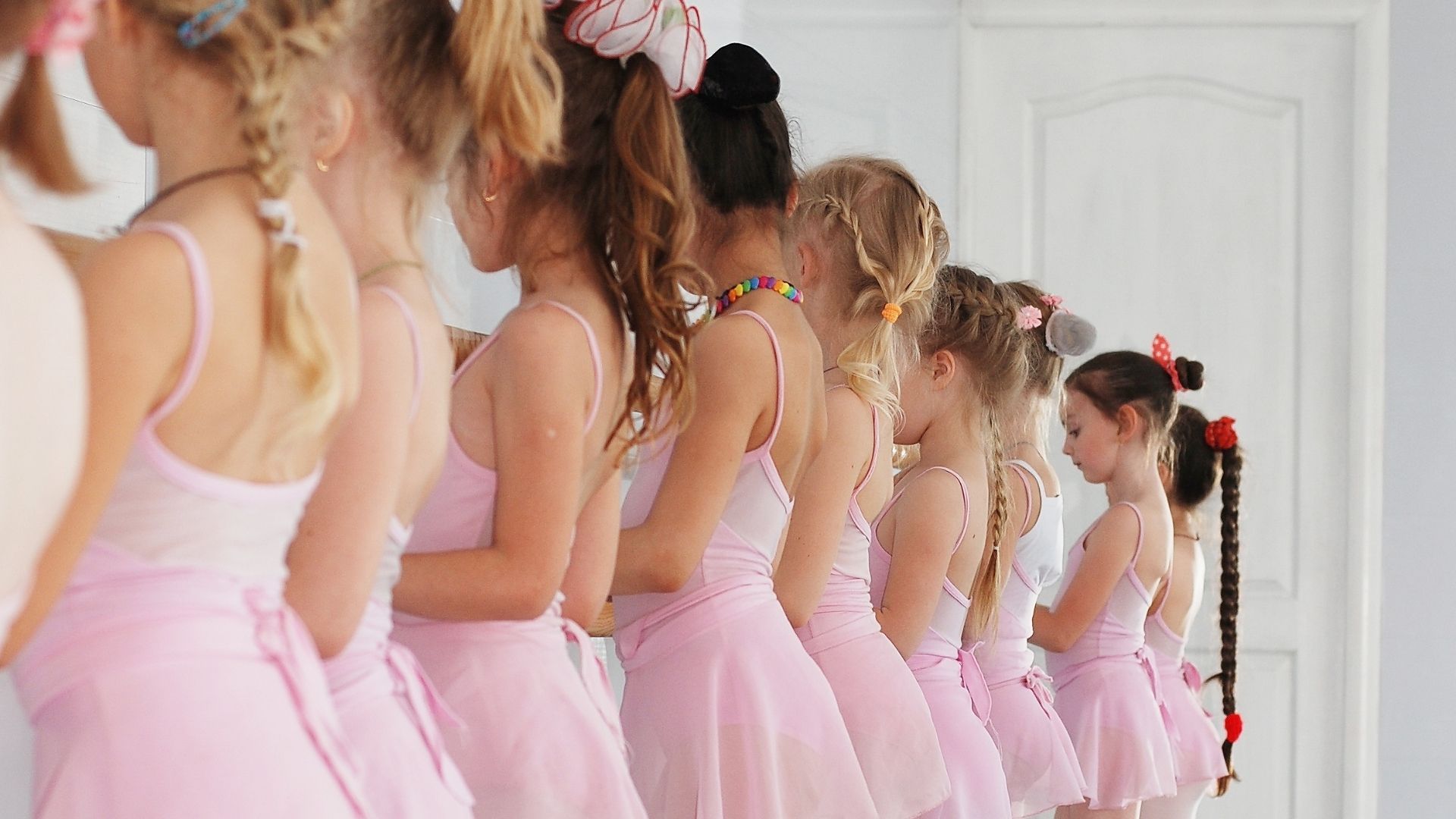 girls lined up at ballet bar