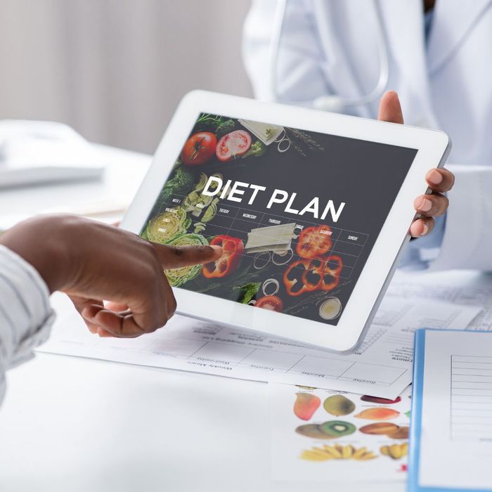 A tablet with a diet plan displayed