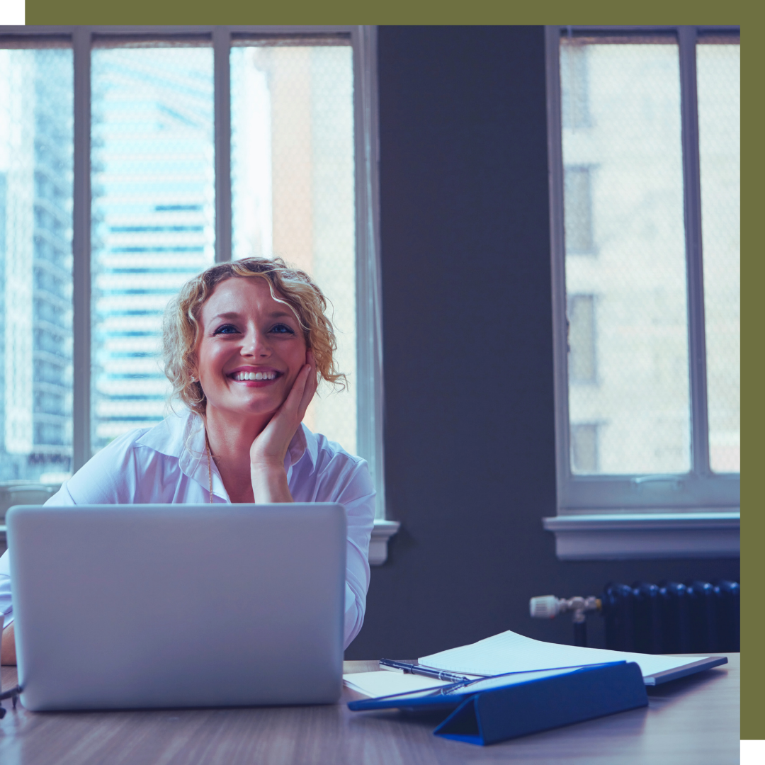 woman smiling at computer