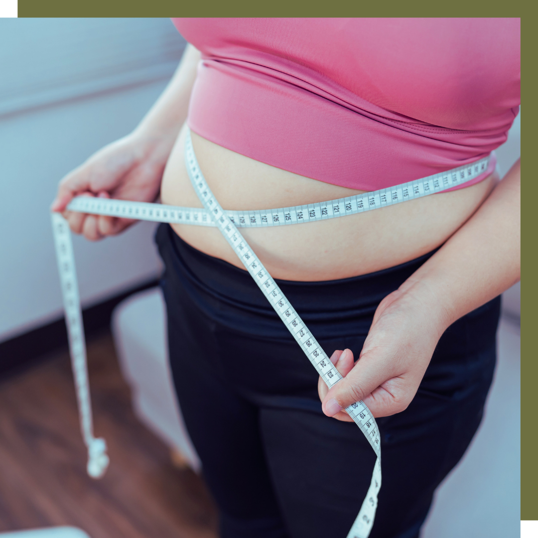 woman measuring waist