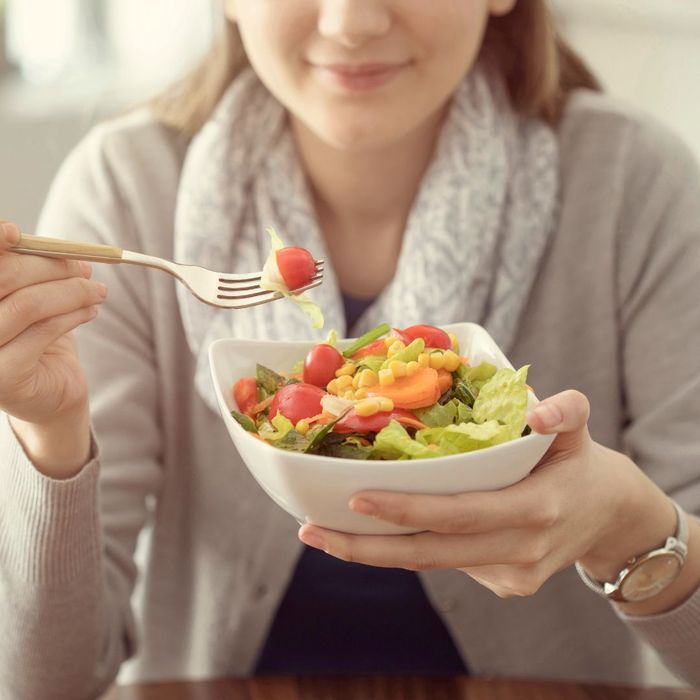 woman eating salad