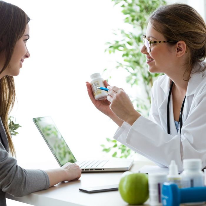 doctor explaining medication to patient