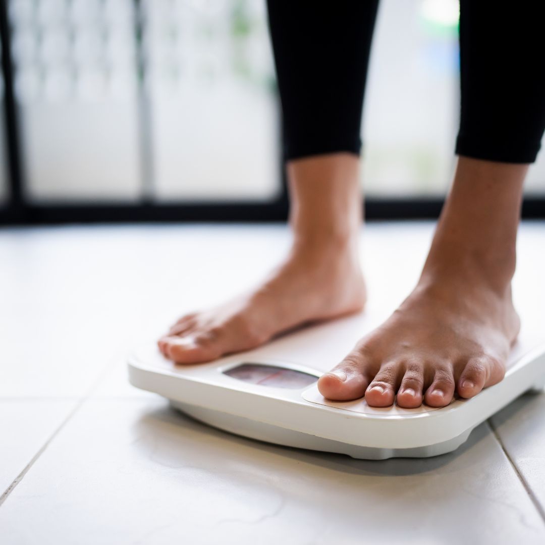 woman standing on scale woman standing on scale