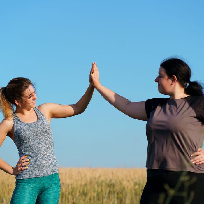 two people high fiving