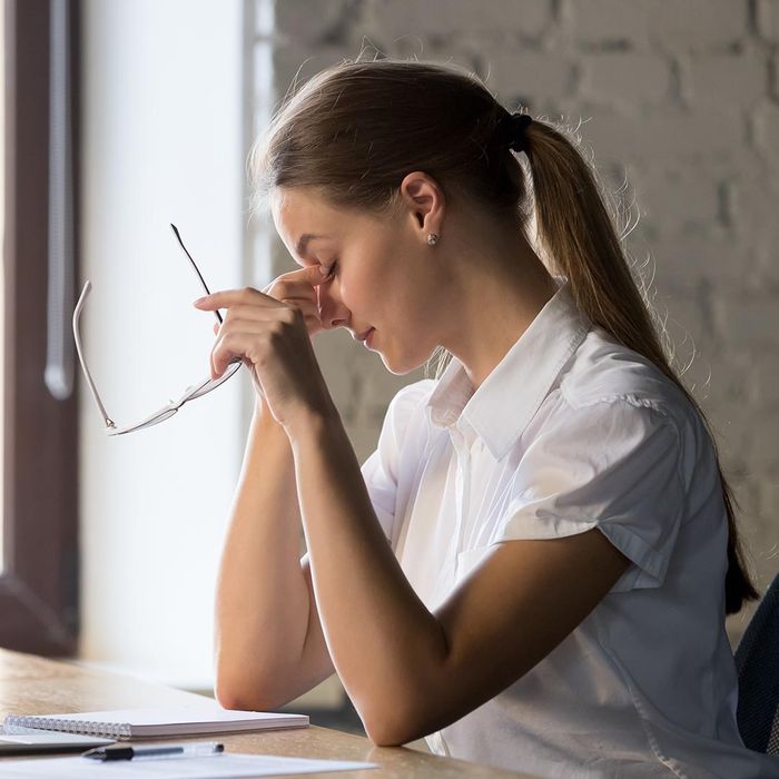 tired woman at desk