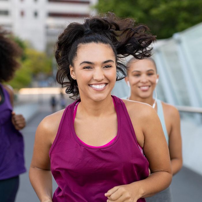 smiling women jogging