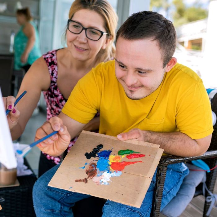 man with special needs painting