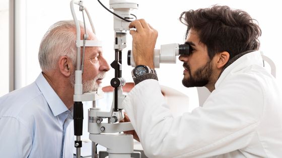 eye doctor and elderly patient 