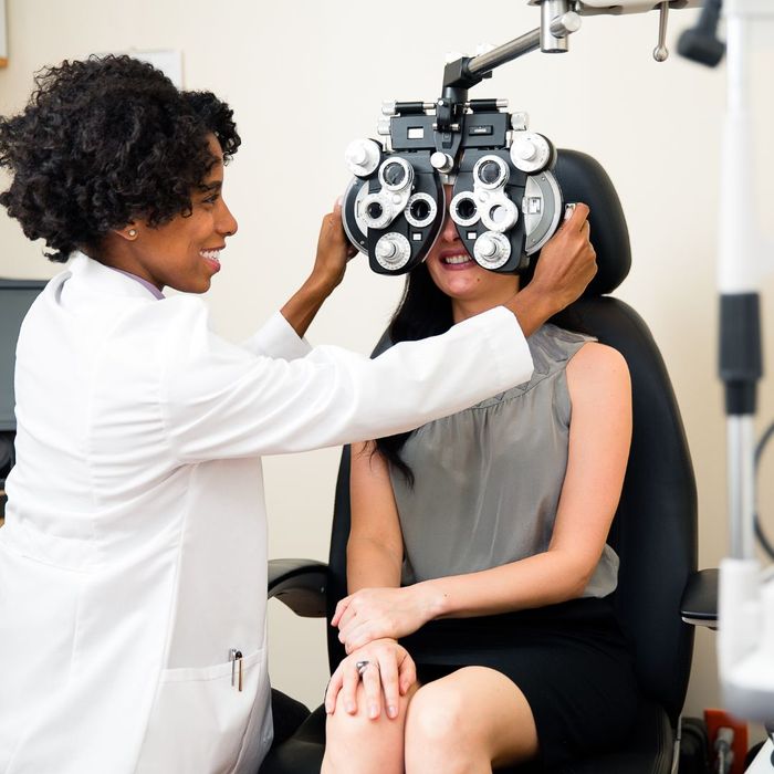 female eye doctor testing a patient 