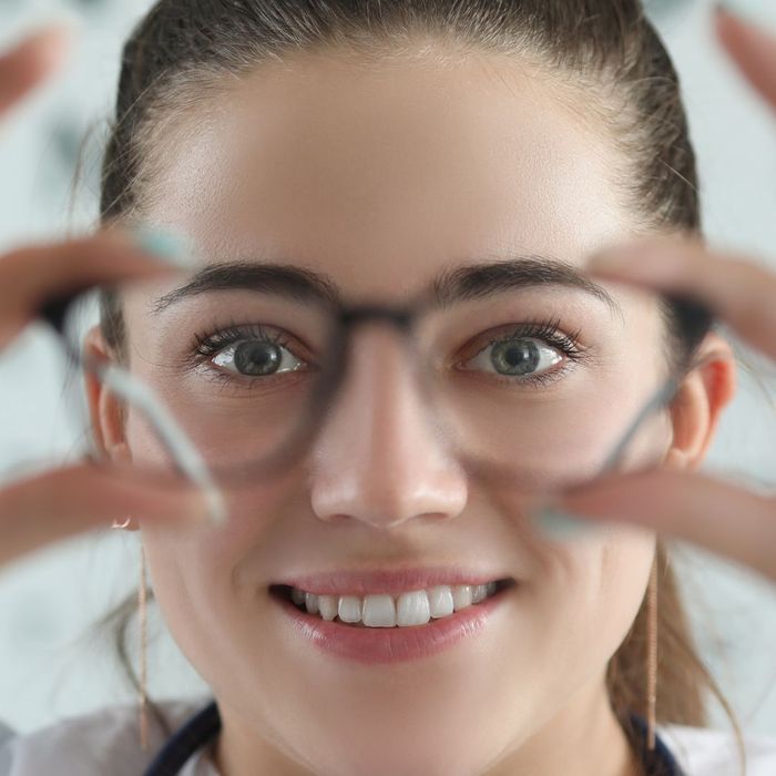woman holding glasses