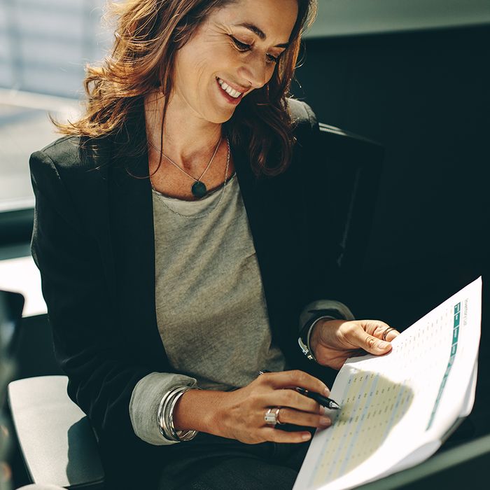 woman looking at paperwork