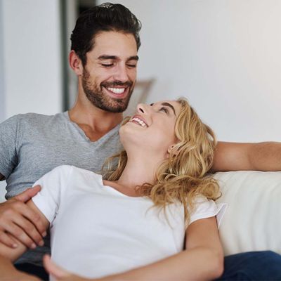 smiling couple on couch