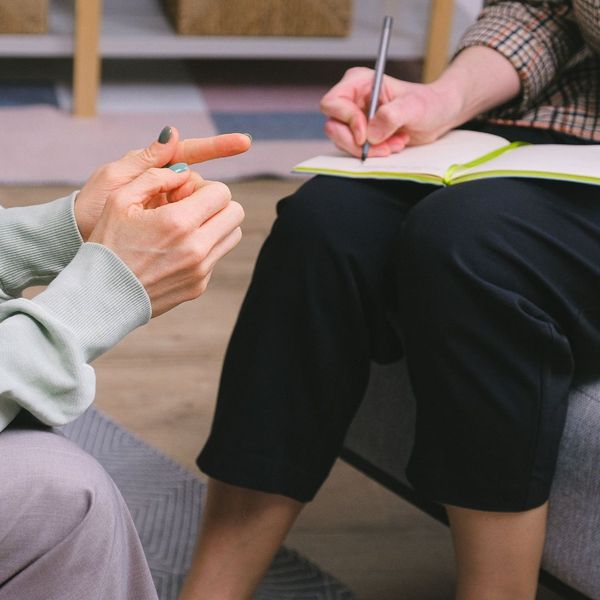 therapist taking notes during session