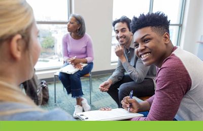 group of happy people in therapy