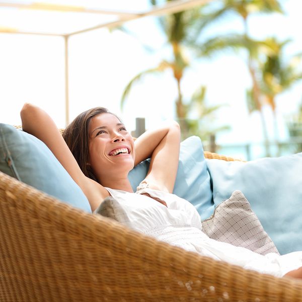 a woman smiling while laying down in her sunroom mindfulness.jpg
