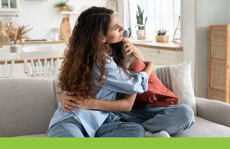 mother hugging and consoling child