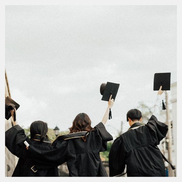 high school graduation taking off caps