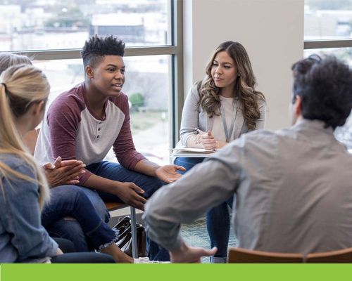 group of younger people in therapy session