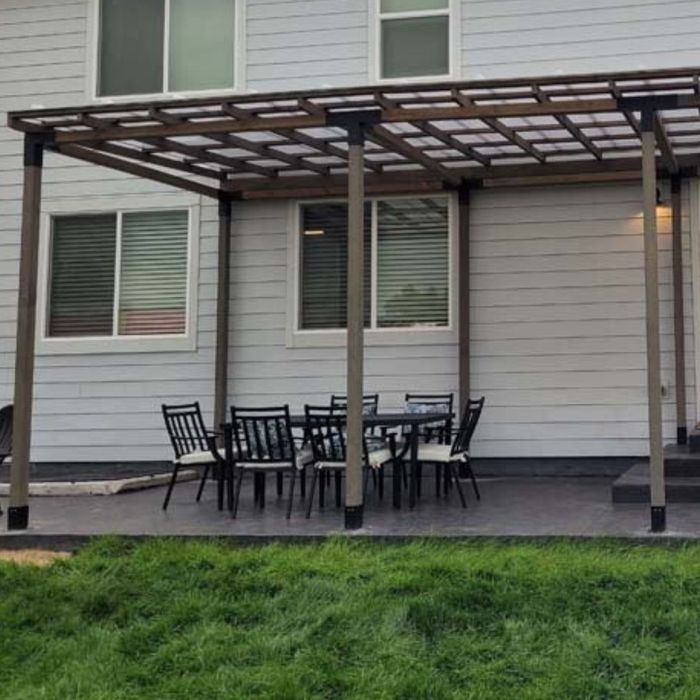 Skypoly Pergola Roof on a back patio dining area