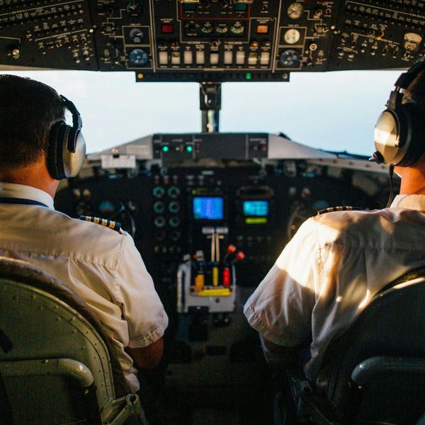 Two pilots flying a plane