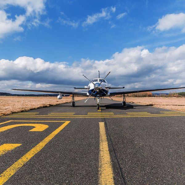 Plane on a runway. Plane on a runway.