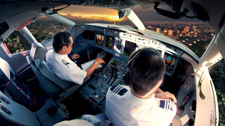 Pilots in plane cockpit