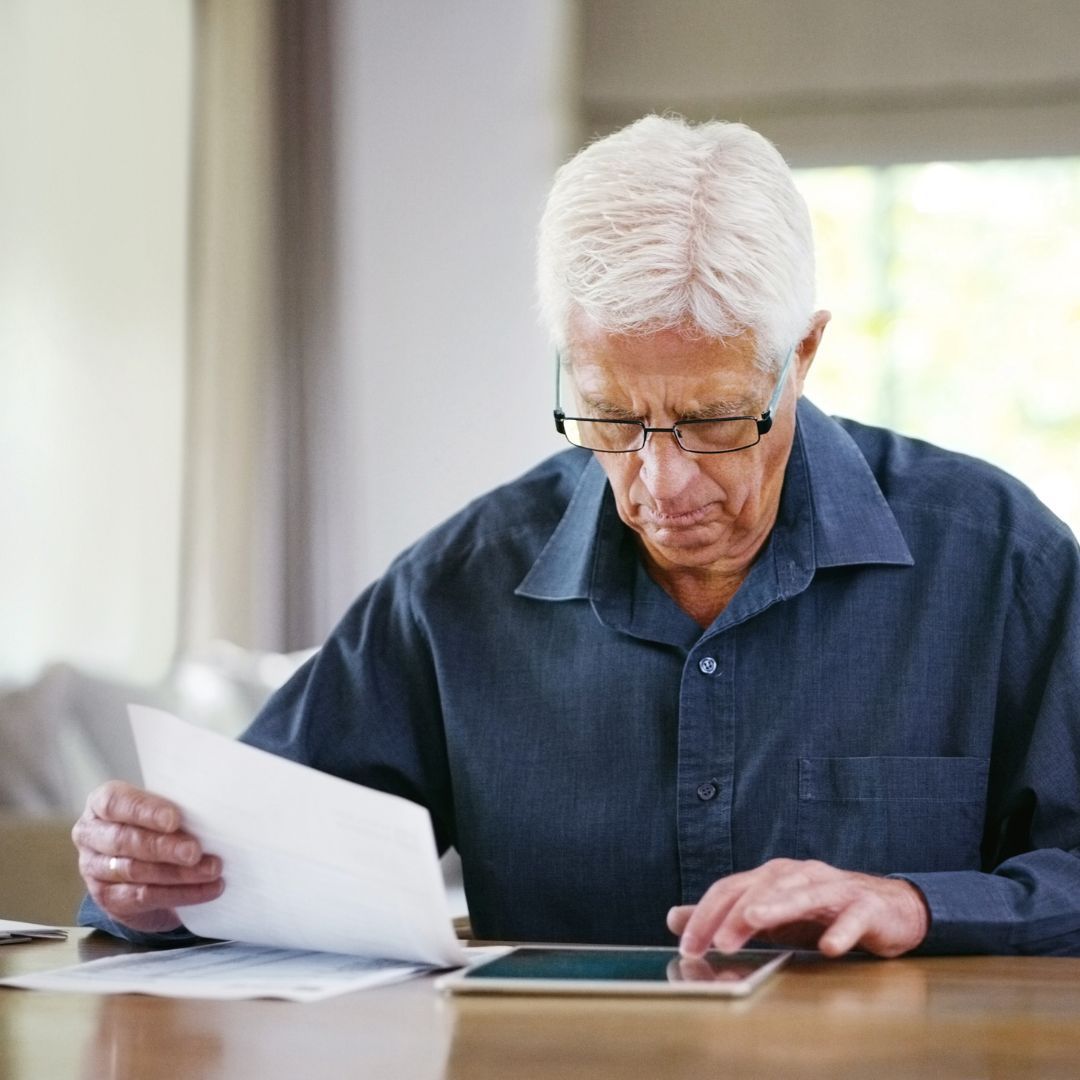 man looking at paperwork