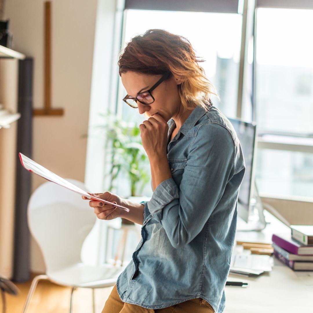 woman looking at paperwork