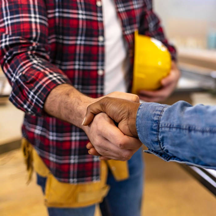 Contractor shaking hands with a client. 