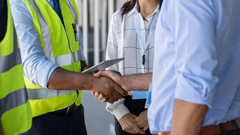 contractors shake hands with business owners