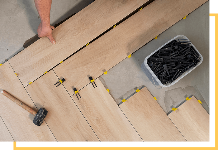 image of a man installing flooring