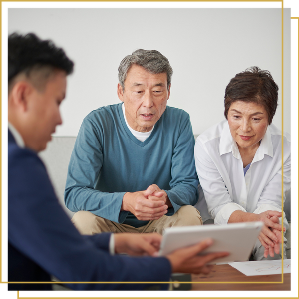 older couple meeting with financial advisor