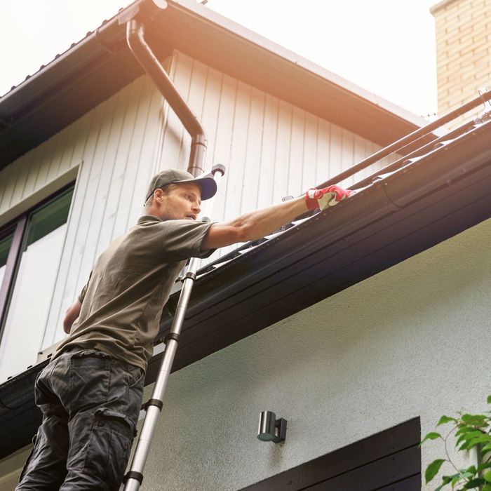 img of someone working on a gutter blog img3.jpg