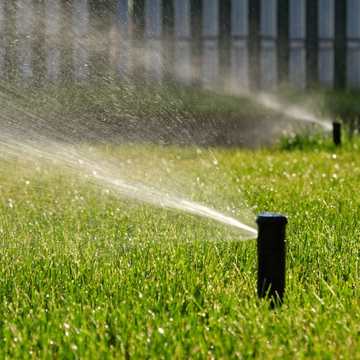 sprinkler running in yard sprinkler running in yard