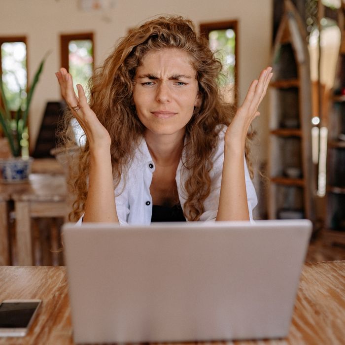 image of a woman looking online landscaping companies
