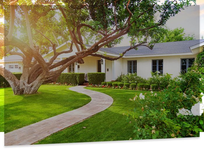 Image of house with a well kept yard