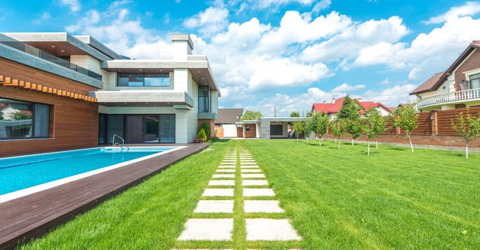 house with green lawn