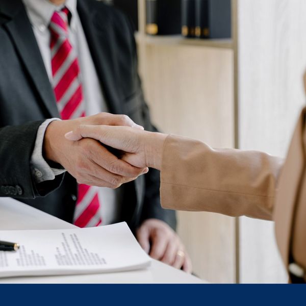 lawyer shaking client's hand