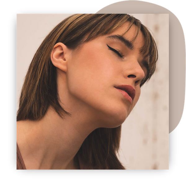 woman with eyes closed, focus on jawline