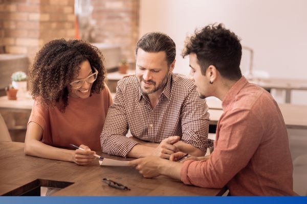 home buyers speaking with mortgage lender