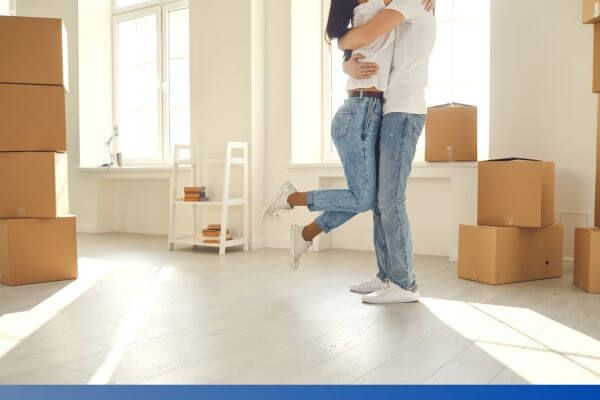 couple hugging in new home
