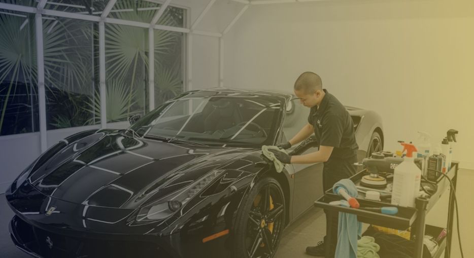 a luxury sports car receiving professional detailing services