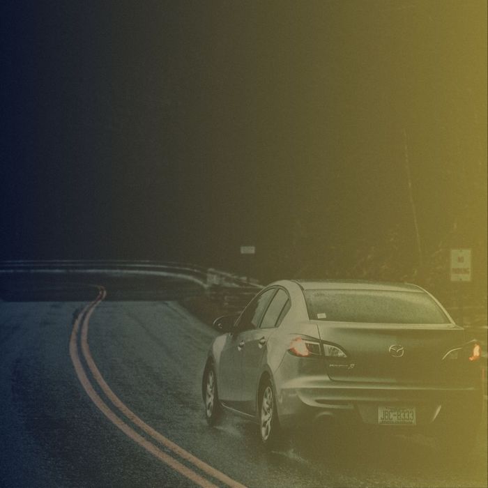 A car driving in the rain
