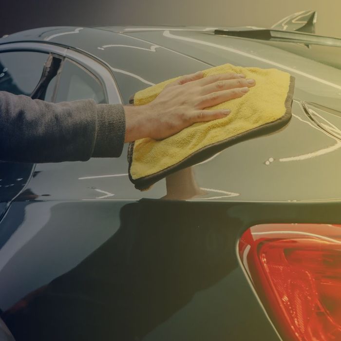 wiping down car