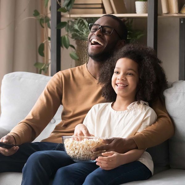 Father and his daughter watching TV