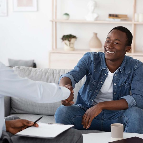 two black men shaking hands