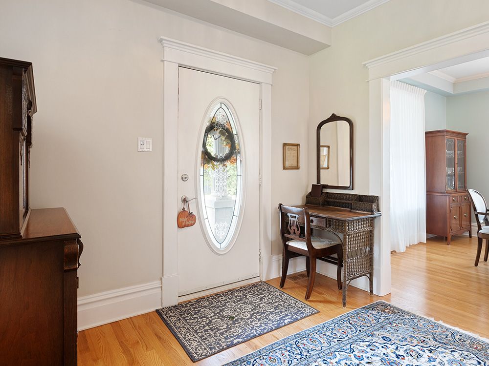 A home's front door with an oval window 