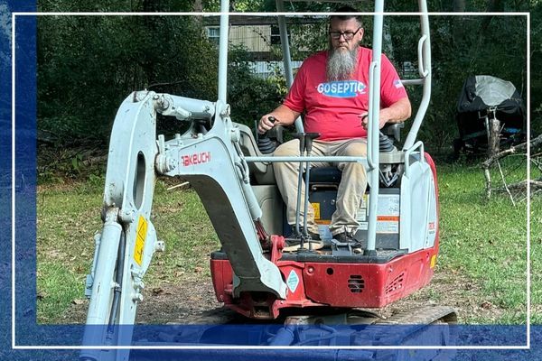 GoSeptic Employee on an excavator